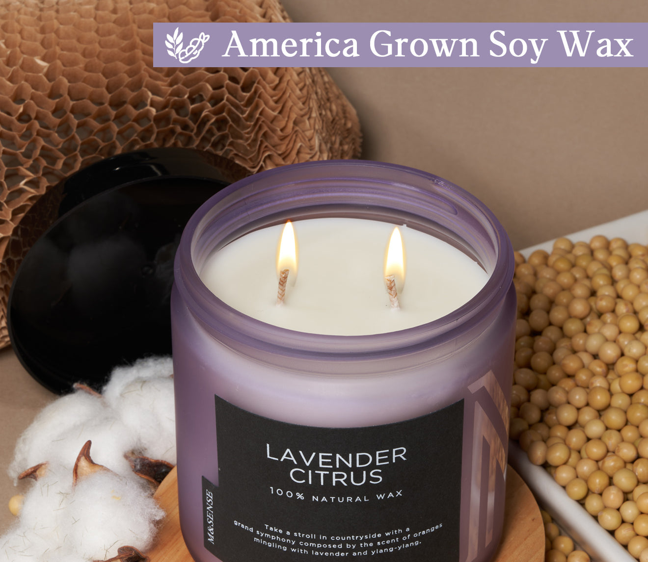 Natural Lavender Citrus soy wax candle with cotton wick, displayed with cotton, soybeans, and recyclable honeycomb paper.