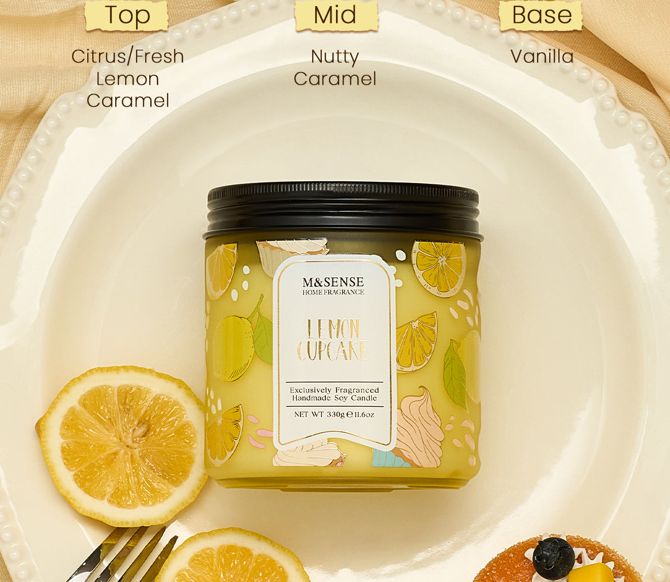 M&SSENSE Lemon Cupcake candle with lemon slices and a fork on a beige background
