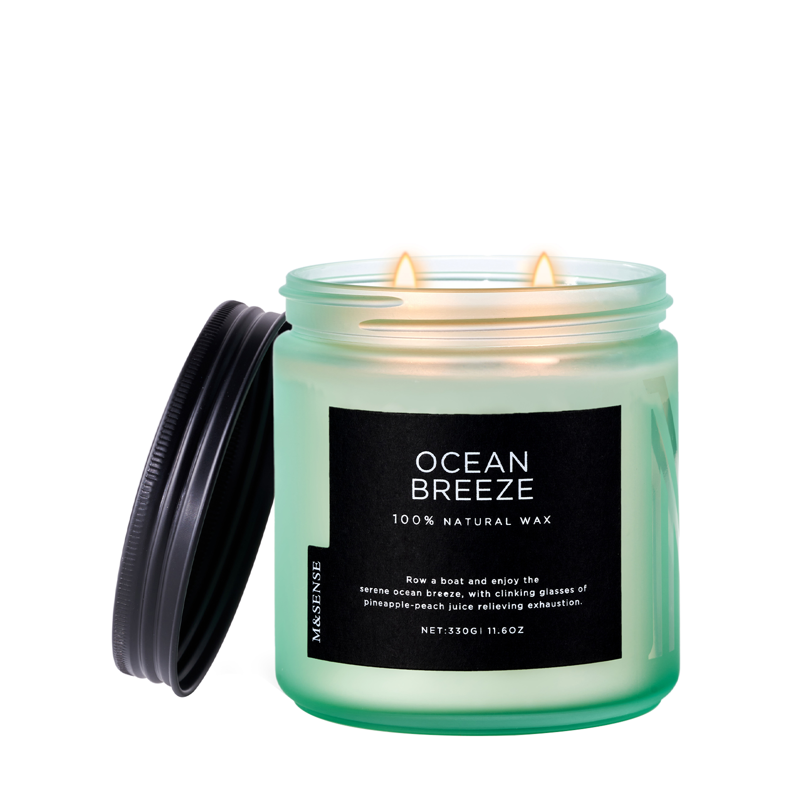 Candle labeled 'Ocean Breeze' with a black lid on a white background