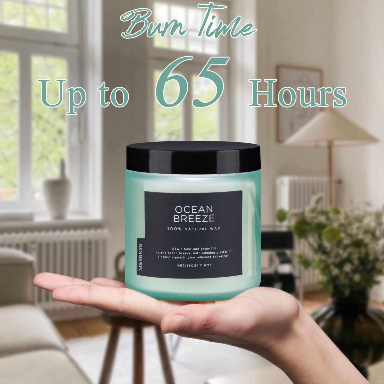 Candle with a label held by hands against a room background, featuring text about burn time and weight.