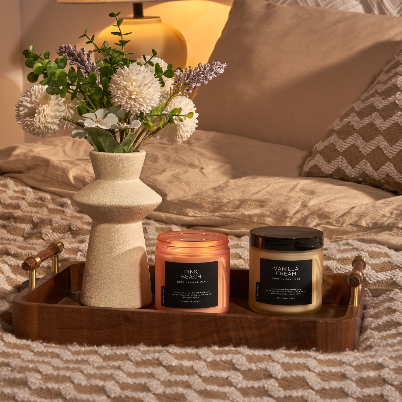 2 bedroom decor frosted glass jar candles on wooden tray beside vase.