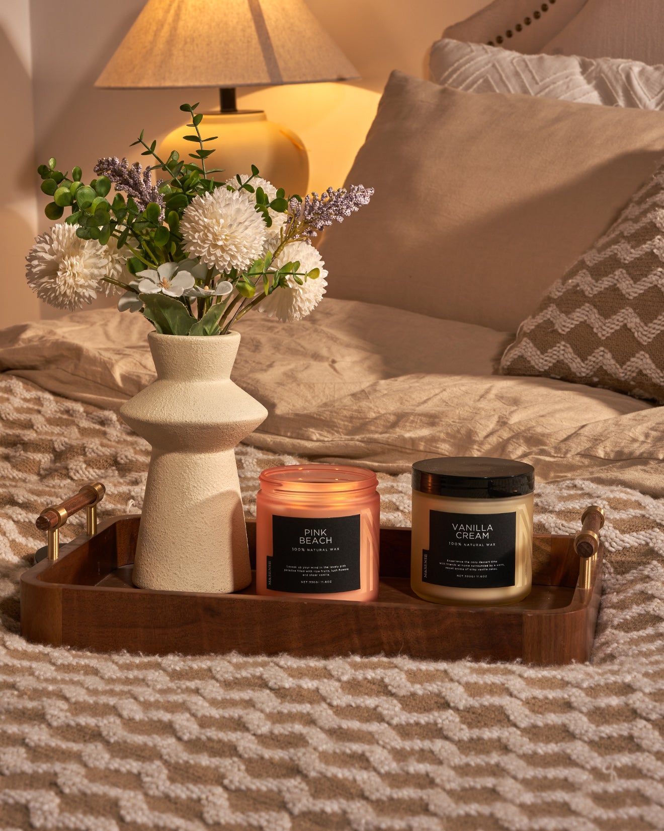 2 bedroom decor frosted glass jar candles on wooden tray beside vase.