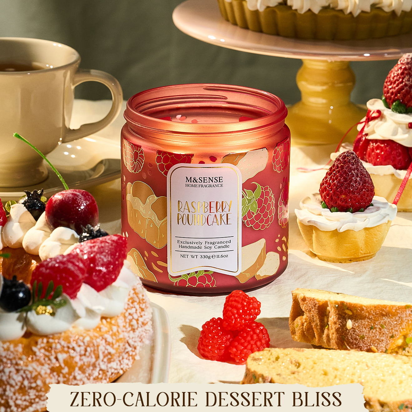 Candle with raspberry pound cake flavor surrounded by desserts on a table