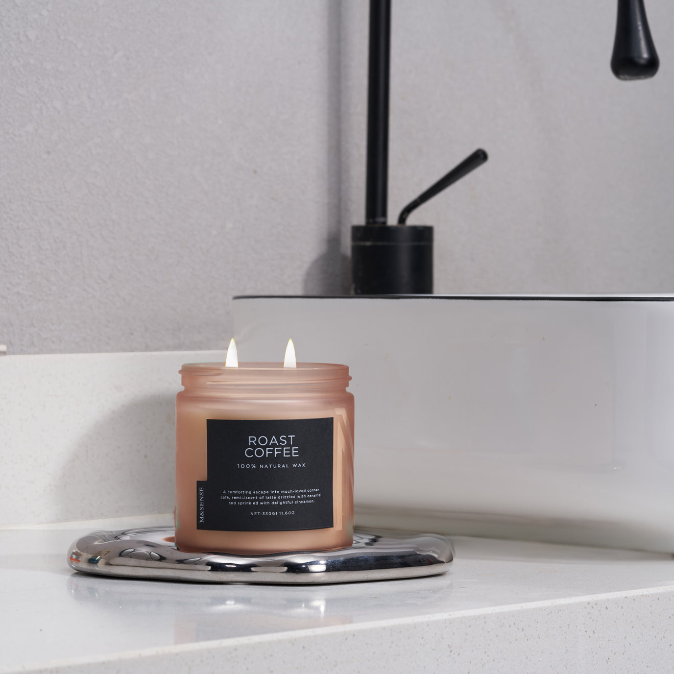 Roast Coffee scented candle on a bathroom vanity, creating an invigorating and cozy aroma for your daily routine.