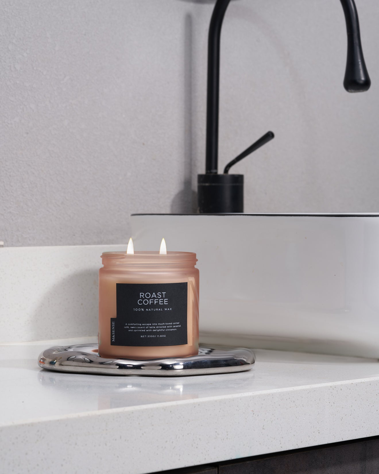 Roast Coffee scented candle on a bathroom vanity, creating an invigorating and cozy aroma for your daily routine.