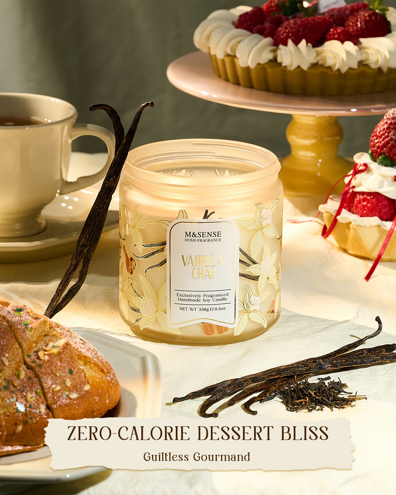 Másónse vanilla bean candle on a table with desserts and vanilla pods.