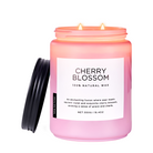 Pink candle labeled 'Cherry Blossom' with a white label on a white background