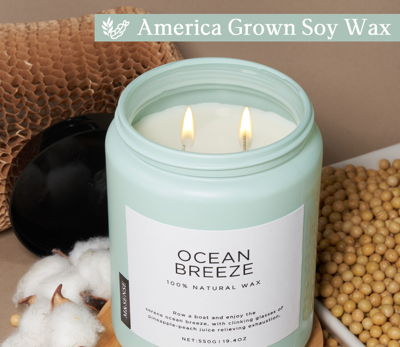 Ocean Breeze candle with soy wax and cotton wick, shown with cotton, soybeans, and recyclable packaging.