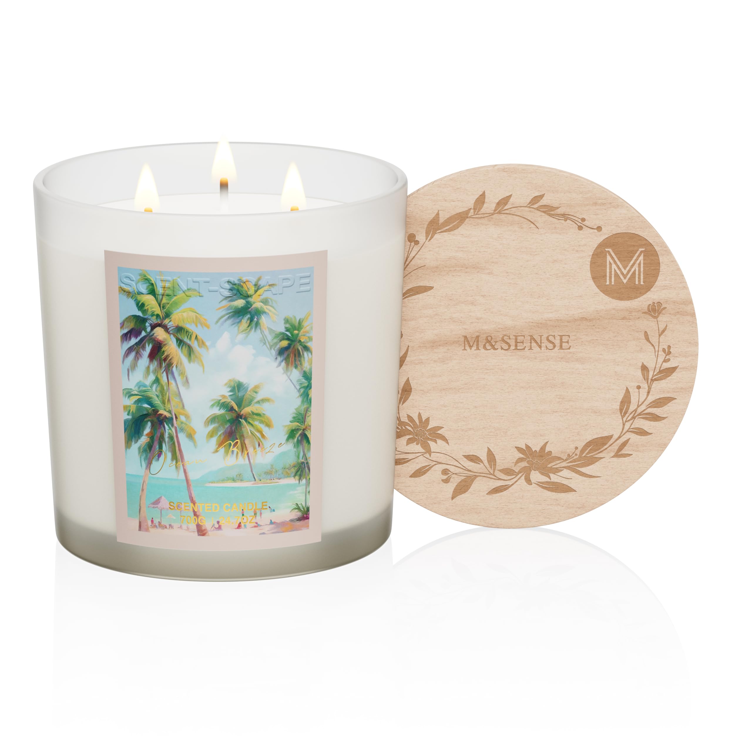 Candle with a palm tree design and wooden coaster on a white background