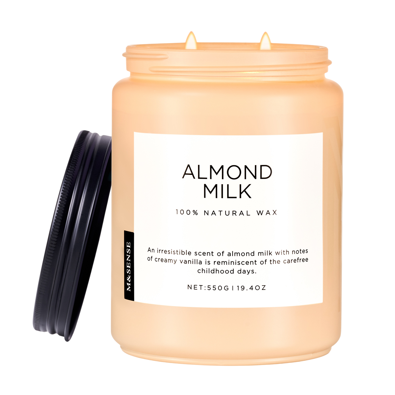 Candle jar labeled 'Almond Milk' with a black lid on a white background
