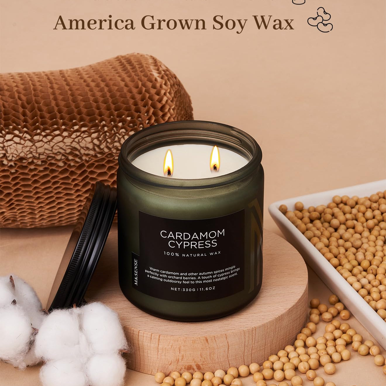 Candle with cotton braid wicks and soy wax, surrounded by cotton and soybeans on a beige background.