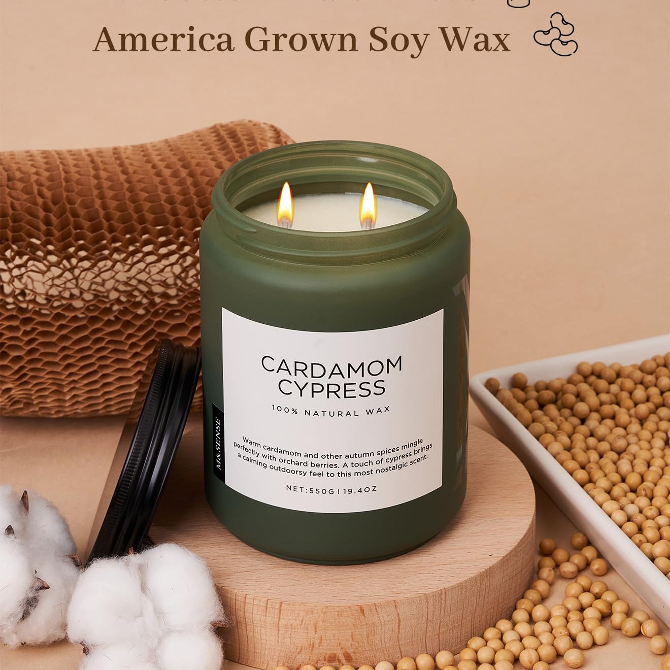 Cardamom Cypress candle with cotton braid wicks and soy wax on a wooden surface.