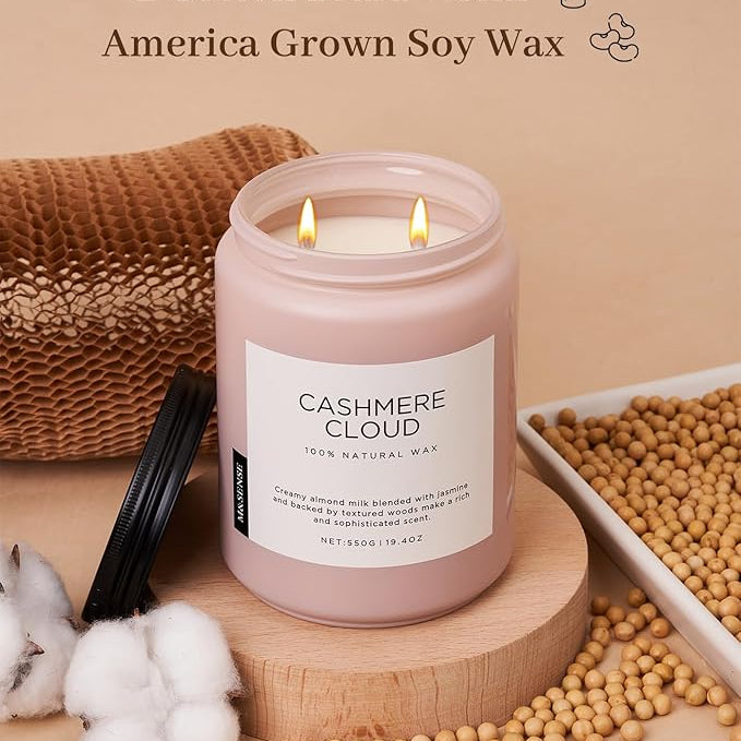 Pink candle labeled 'Cashmere Cloud' with cotton braid wicks and soy wax on a beige background
