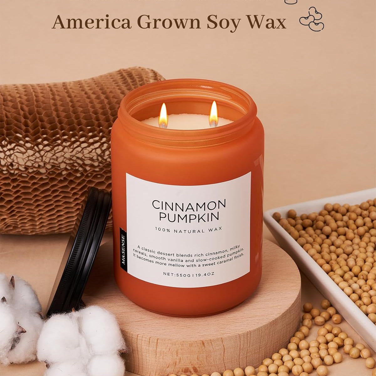 Cinnamon pumpkin candle with cotton braid wicks and soy wax on a beige background