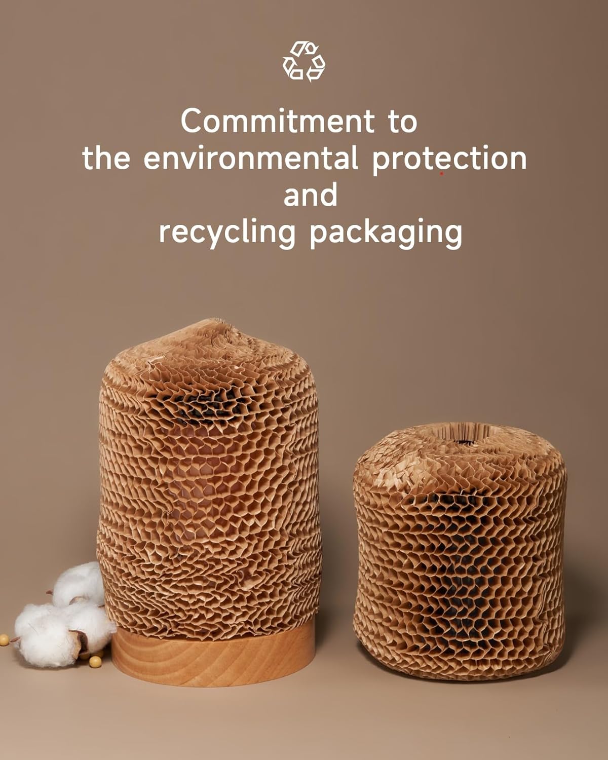 Two cardboard packaging rolls with cotton fibers on a brown background, emphasizing environmental protection and recycling.