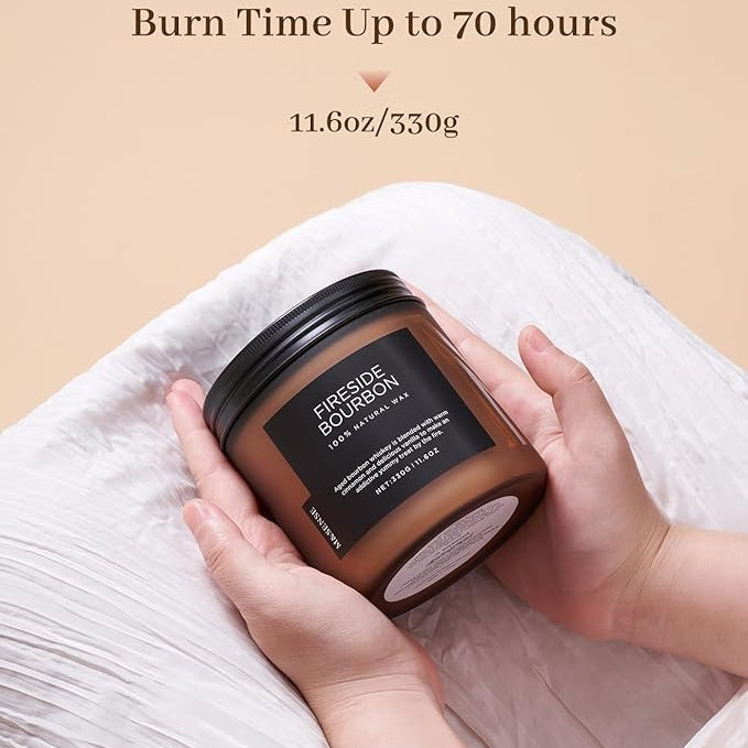 Candle jar held by hands with 'Fre suede Bourdon' branding on a beige background