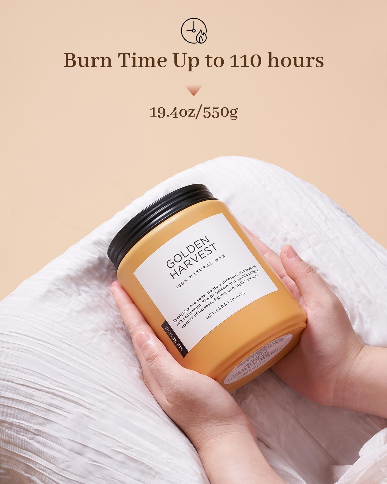 Hand holding a 'Golden Harvest' candle with product details on a beige background