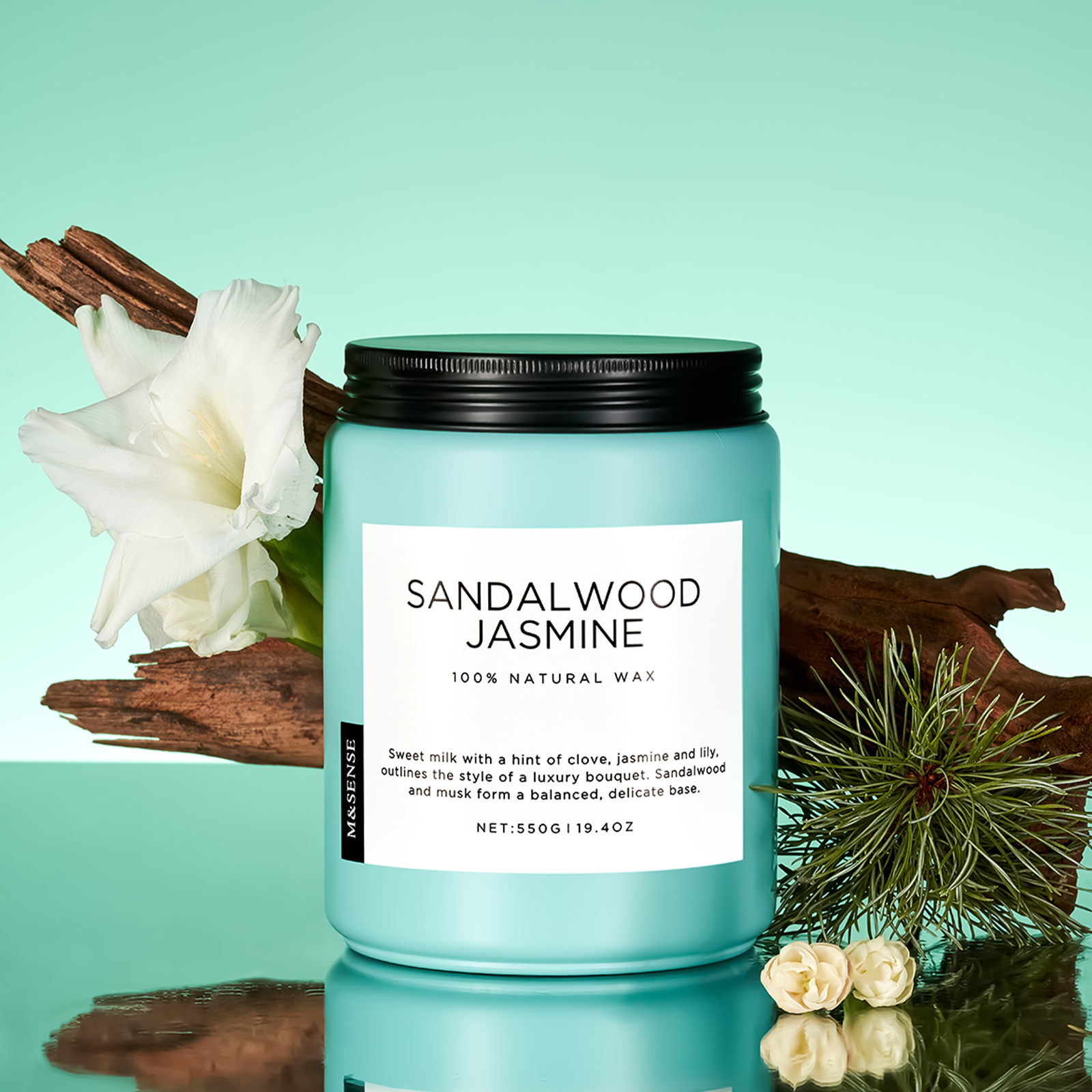 Candle labeled 'Sandalwood Jasmine' with natural elements on a teal background