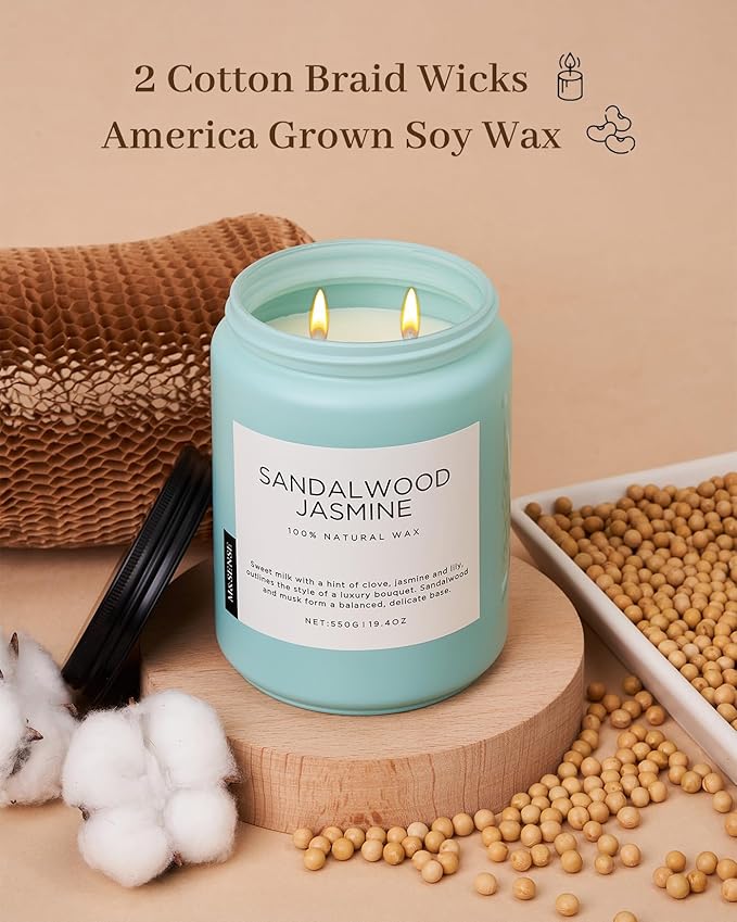 Candle with sandalwood jasmine scent on a wooden stand with cotton and soybeans, labeled '2 Cotton Braid Wicks America Grown Soy Wax'.