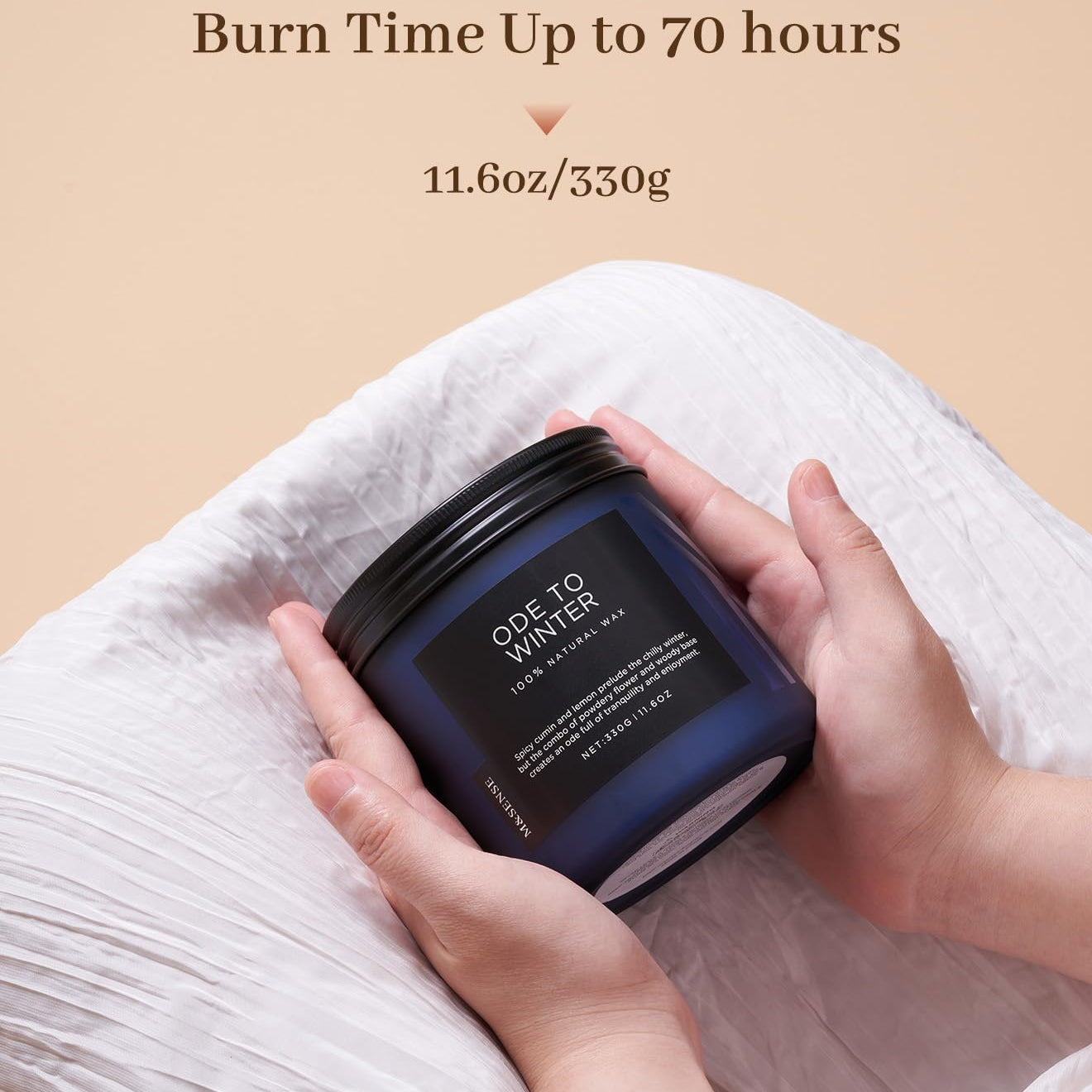 Candle jar held by a hand with 'Burn Time Up to 70 hours' and '11.6oz/330g' text on a beige background.