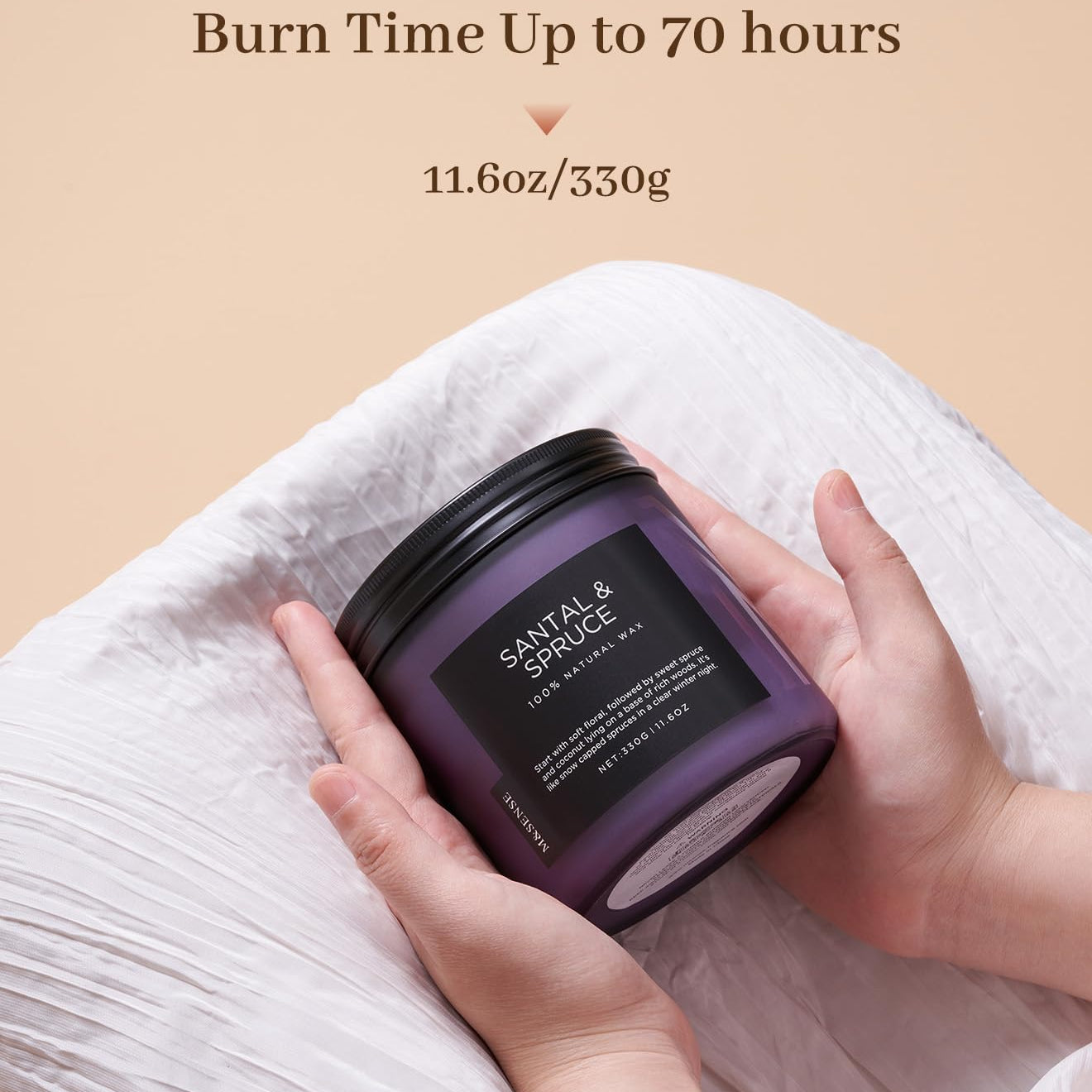 Hand holding a purple candle with text about burn time and weight on a beige background