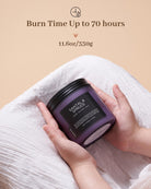 Hand holding a purple candle with text about burn time and weight on a beige background