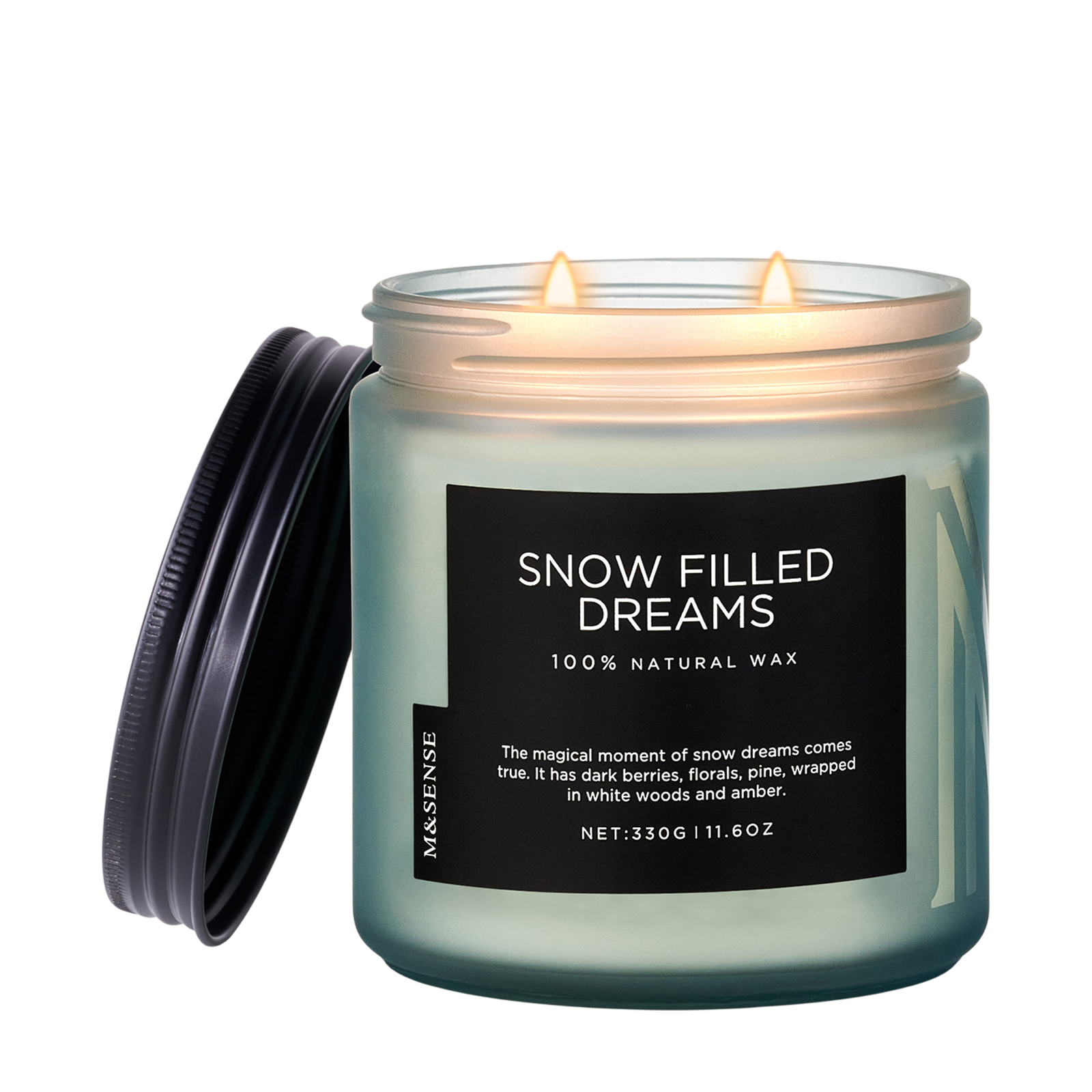 Candle jar labeled 'Snow Filled Dreams' with a black lid on a white background