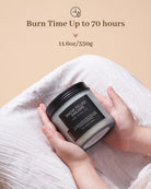 Candle labeled 'Snow Filled Dreams' held by a hand with beige background and text about burn time.