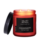 Red candle jar labeled 'Velvet Petals' with a black lid on a white background