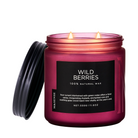 Pink candle jar labeled 'Wild Berries' with a black lid on a white background