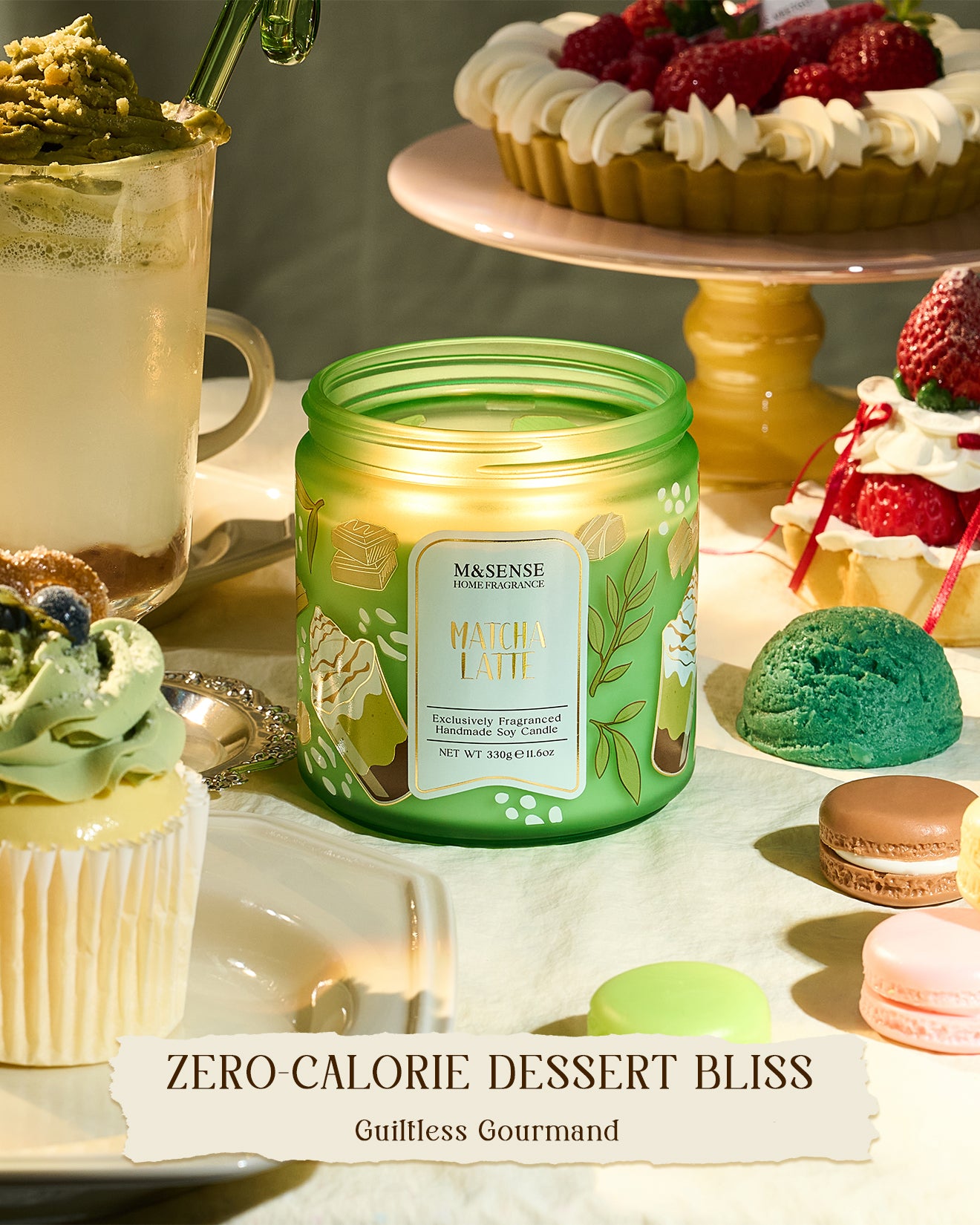 Green candle labeled 'Matcha Latte' on a table with desserts