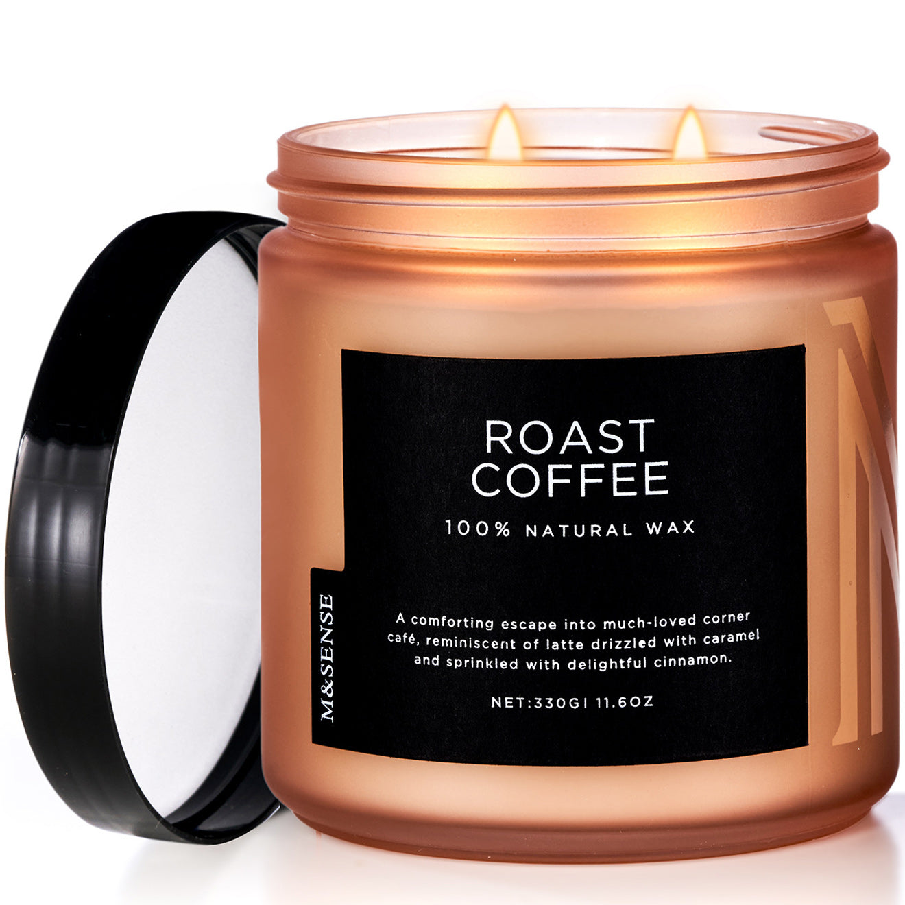 A cylindrical candle with an open lid labeled 'Roasted Coffee' by M&Sense, with a warm brown color and a lit candle inside.