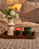 Strawberry Ice Cream candle on a side table, adding a sweet aroma to a cozy living room.