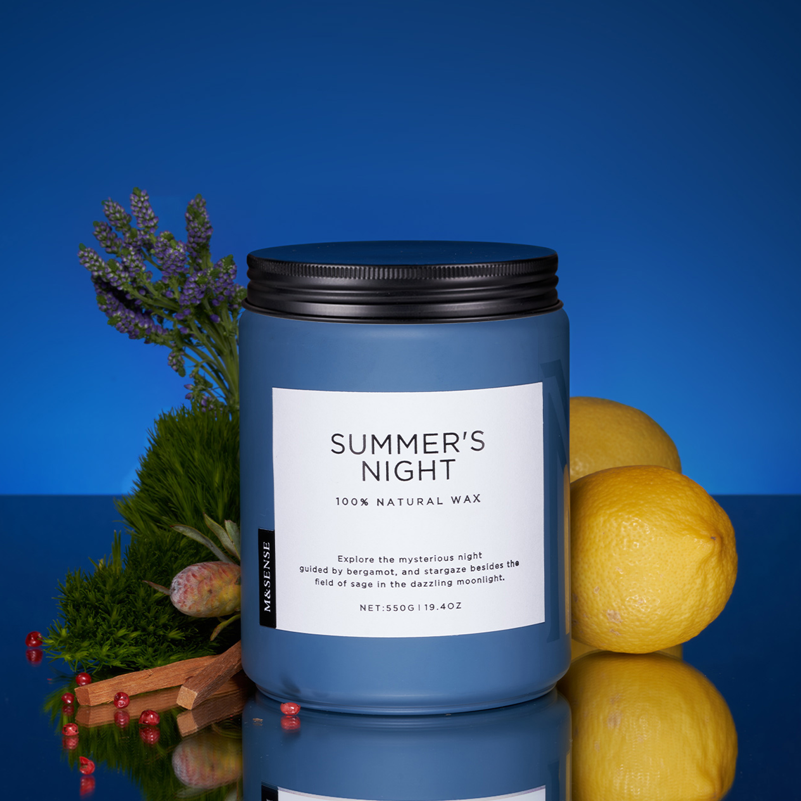 Candle labeled 'Summer's Night' with lemons, lavender, and cinnamon on a reflective surface with a blue gradient background.