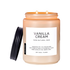 Vanilla Cream scented candle in a blue glass jar, labeled 100% natural wax on a white background.