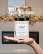 Vanilla Cream scented candle held in a palm, showcasing its 110-hour maximum burn time.