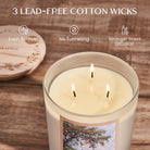 Candle with three lead-free cotton wicks on a wooden surface