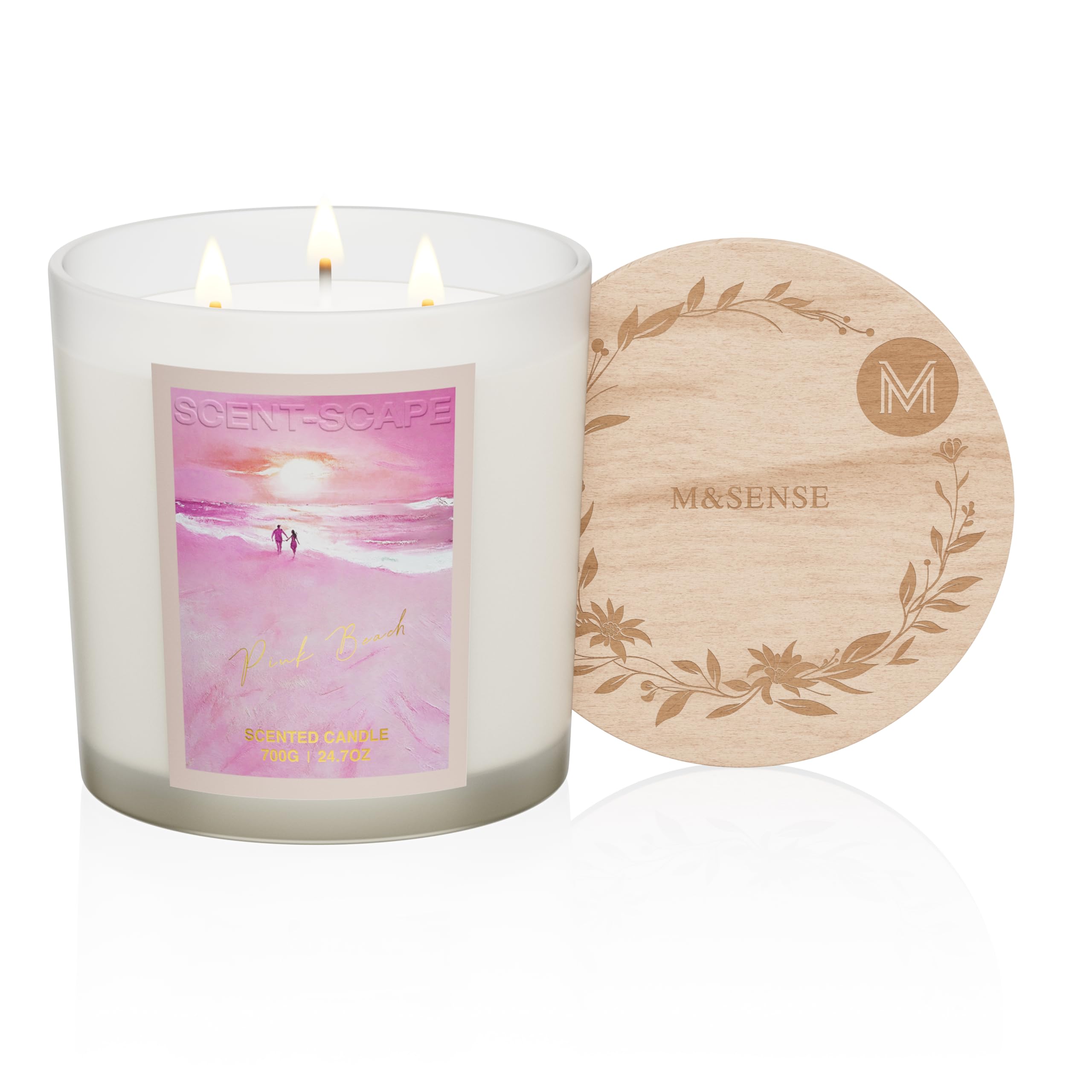 Scented candle with a beach scene label and wooden coaster on a white background