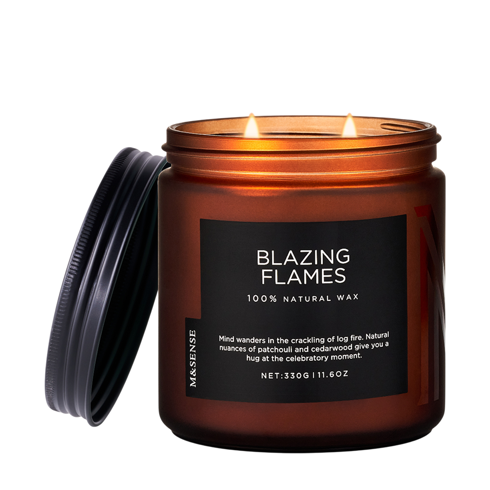 Candle in a brown jar labeled 'Blazing Flames' with a black lid on a white background