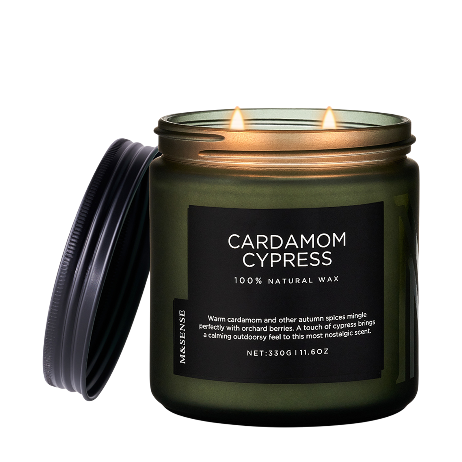 Green candle with 'Cardamom Cypress' label on a white background