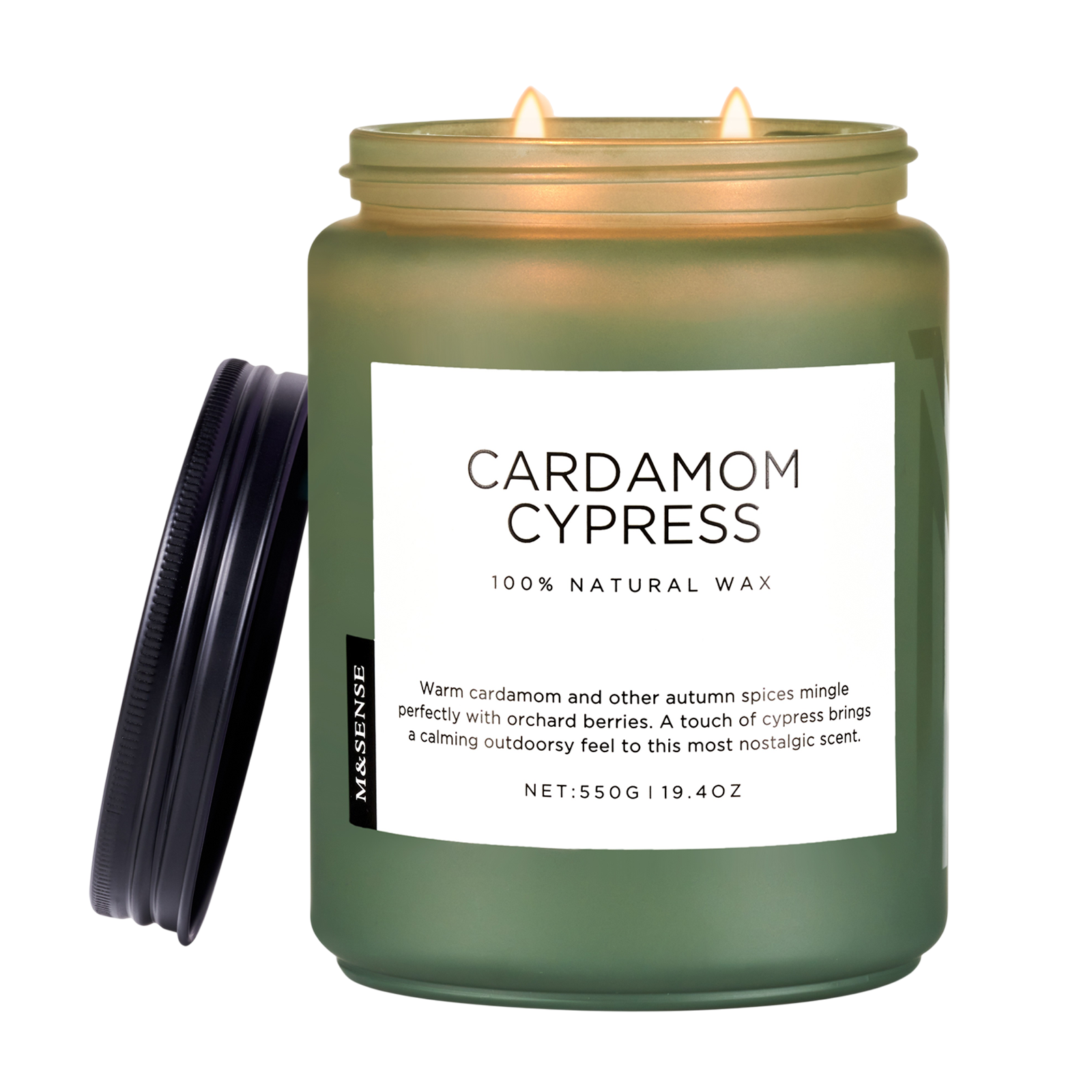 Green candle labeled 'Cardamom Cypress' with a white label on a white background