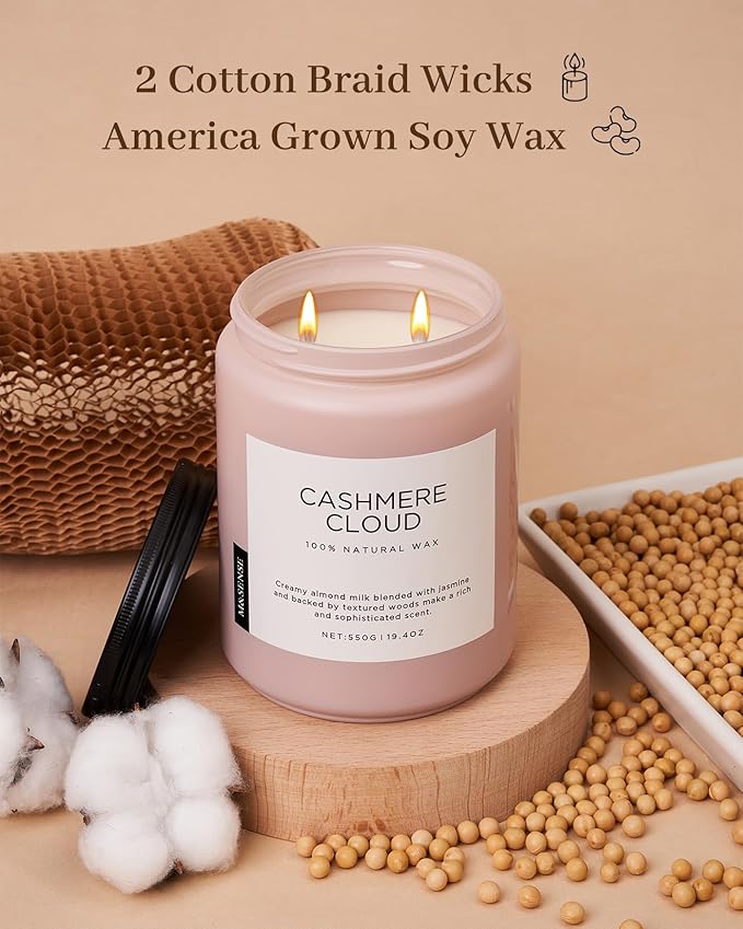 Pink candle labeled 'Cashmere Cloud' with cotton braid wicks and soy wax on a beige background