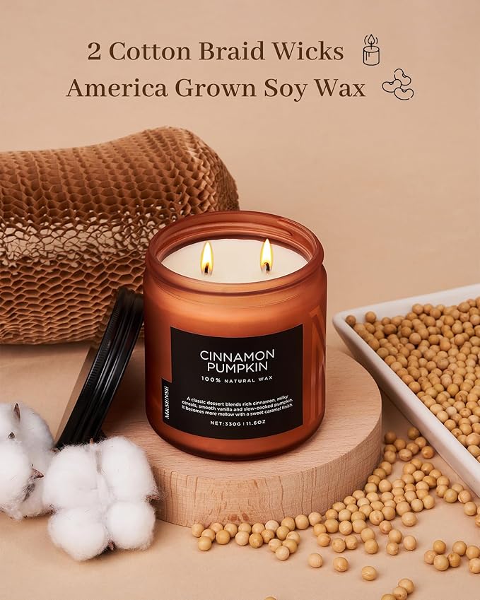 Candle with cotton braid wicks and 'Cinnamon Pumpkin' label on a beige background