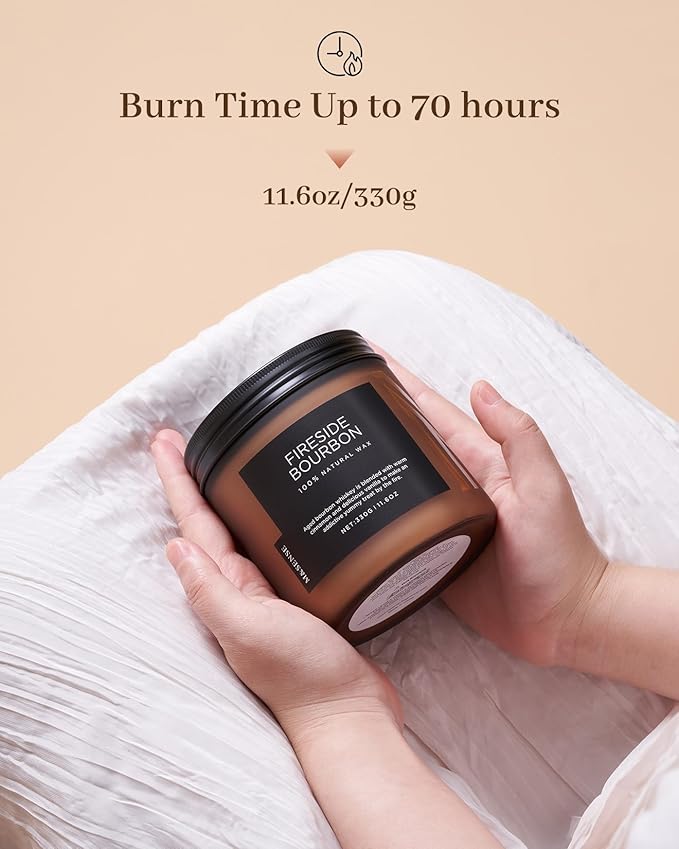 Candle jar held by hands with 'Fre suede Bourdon' branding on a beige background