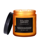 Candle jar labeled 'Golden Harvest' with a black lid on a white background