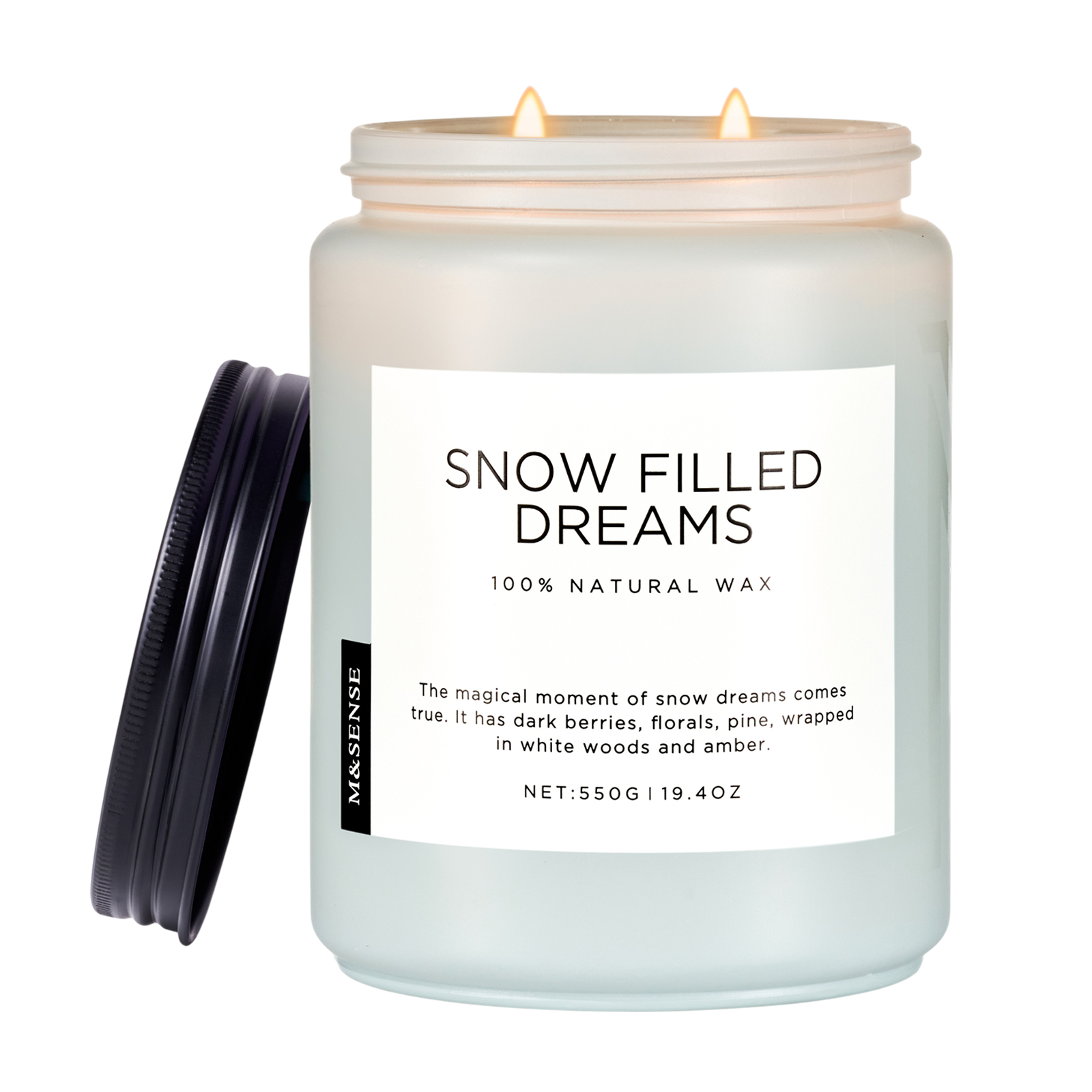 Candle in a jar labeled 'Snow Filled Dreams' with a white label on a white background