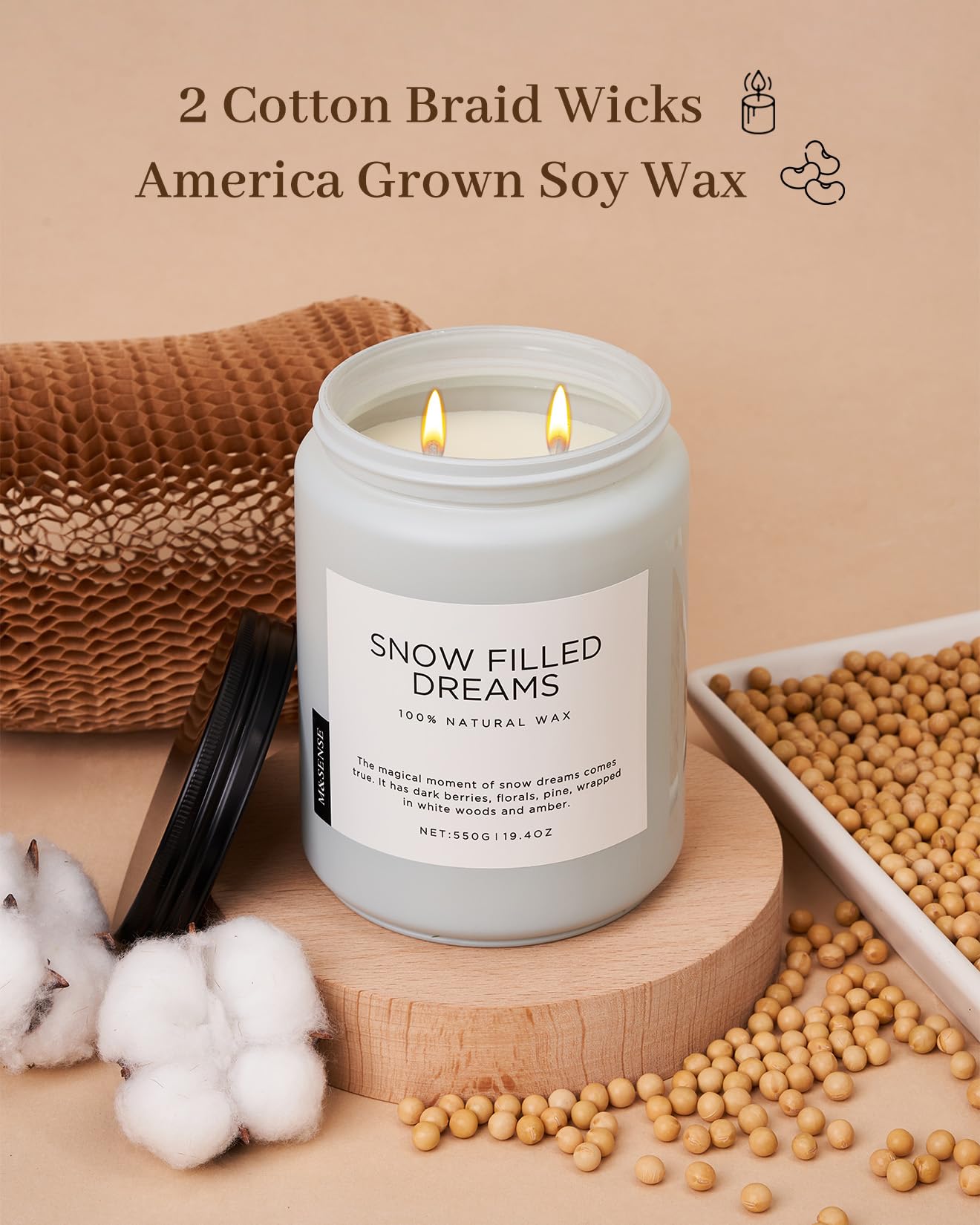 Candle labeled 'Snow Filled Dreams' with cotton braid wicks and soy wax on a beige background