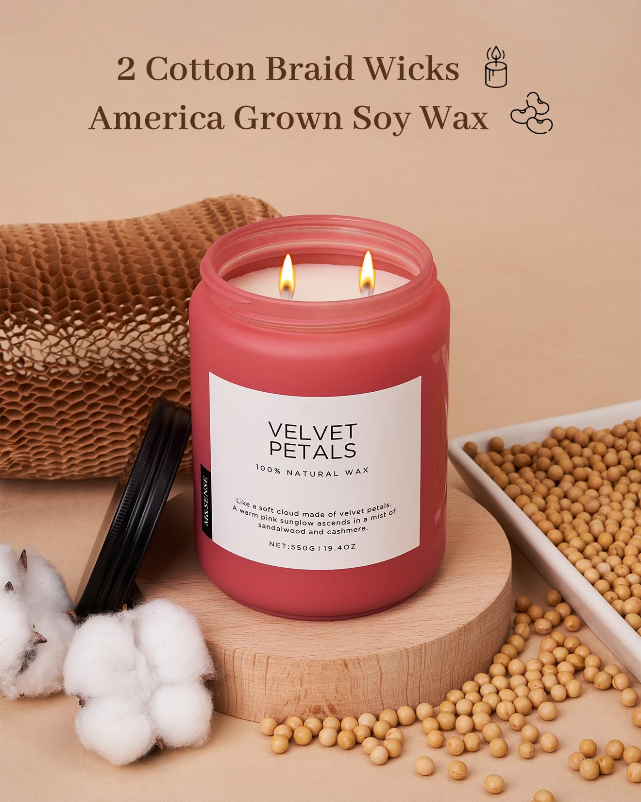 Pink candle labeled 'Velvet Petals' with cotton braid wicks and 'America Grown Soy Wax' text on a beige background.