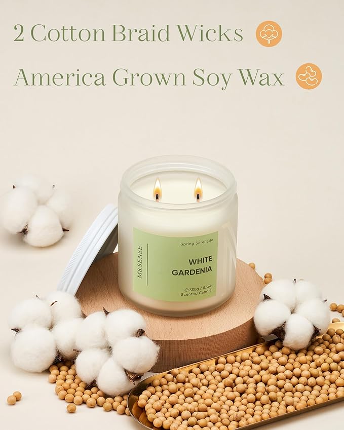 White candle labeled 'White Gardenia' with cotton bolls and soybeans on a light background