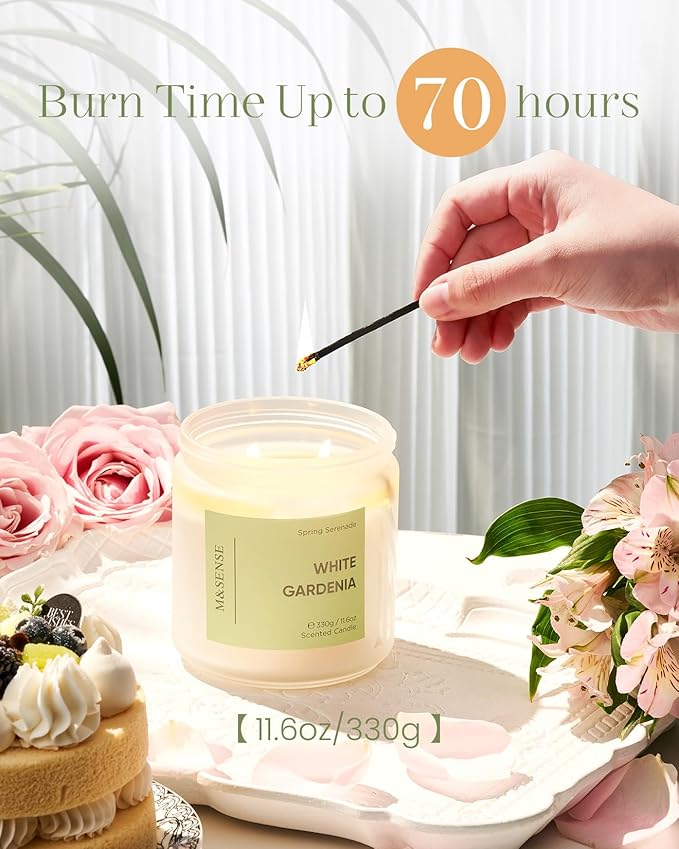 Candle with a hand lighting it, surrounded by flowers and a cake, with text indicating burn time.